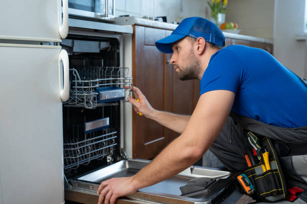 Technician is repairing dishwasher appliance in North Vancouver.